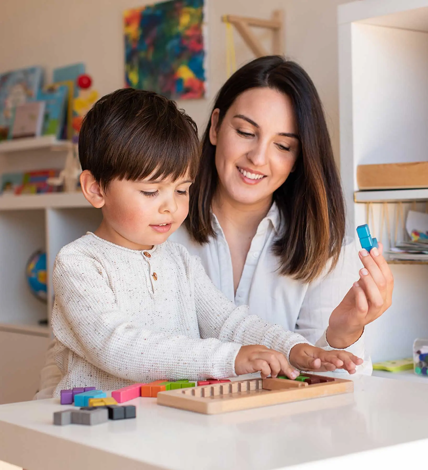 kid playing with tetris wood puzzle